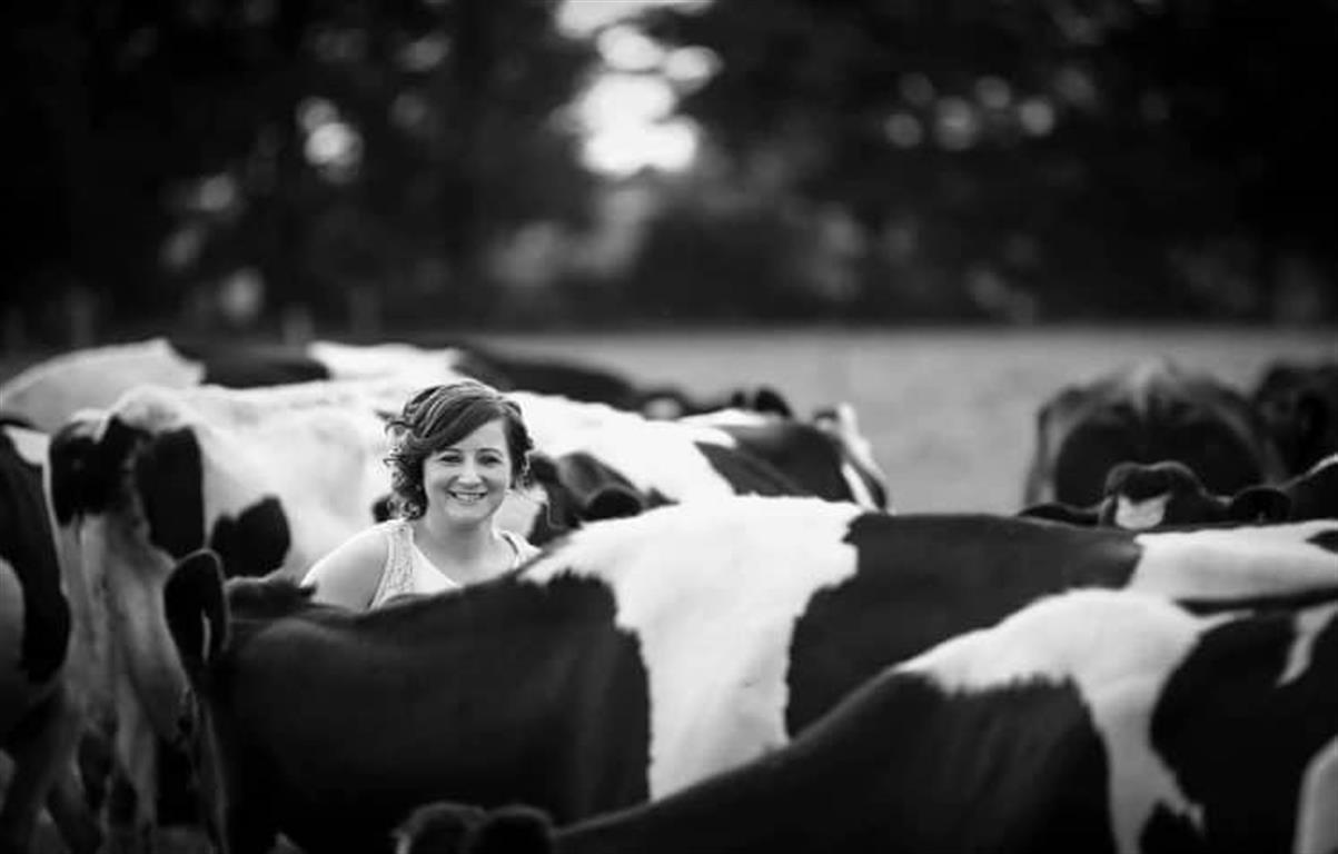 Helen farmer in field with cows