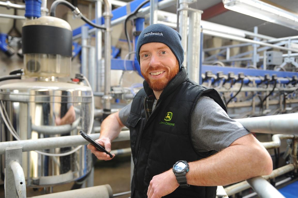 dairy farmer in the milking parlour